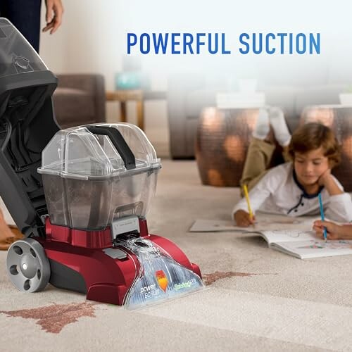 Carpet cleaner with powerful suction on a carpet near a child drawing.