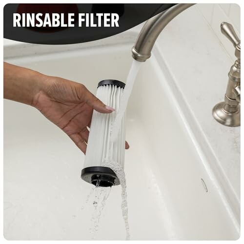 Hand rinsing a filter under a faucet